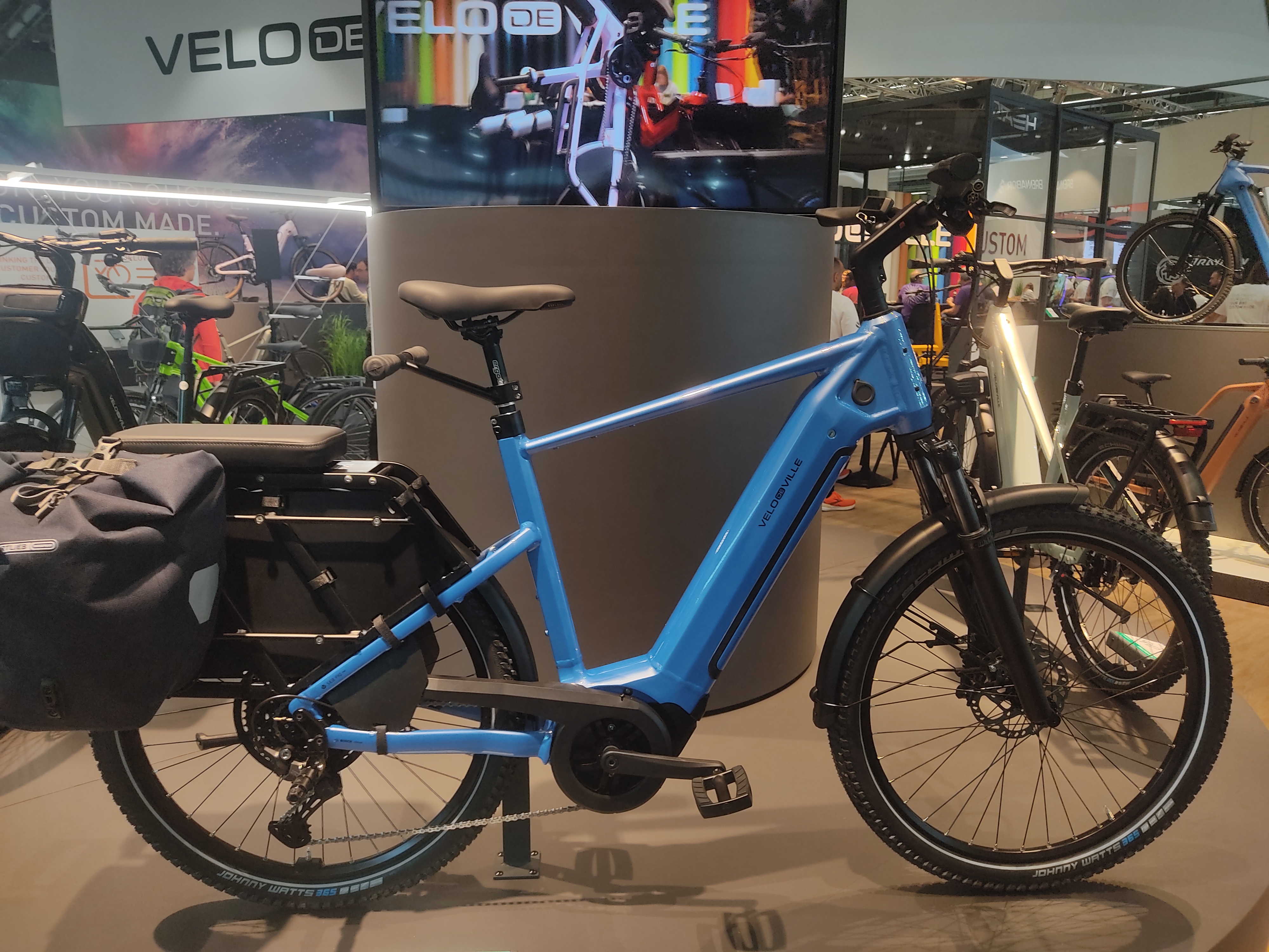 A Velo de Ville SEB990, the rear rack is longer than usual and has a cushion, bars to hold onto and a set of Ortlieb panniers